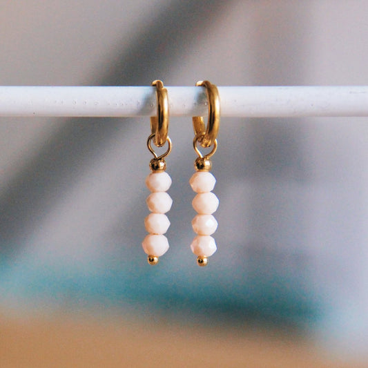 Stainless steel hoop earrings with facets - pale nude