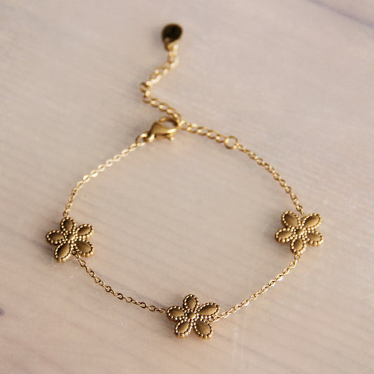 Stainless steel bracelet with 3 flowers – gold